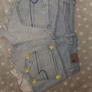 Custom yellow flower detail American Eagle shorts